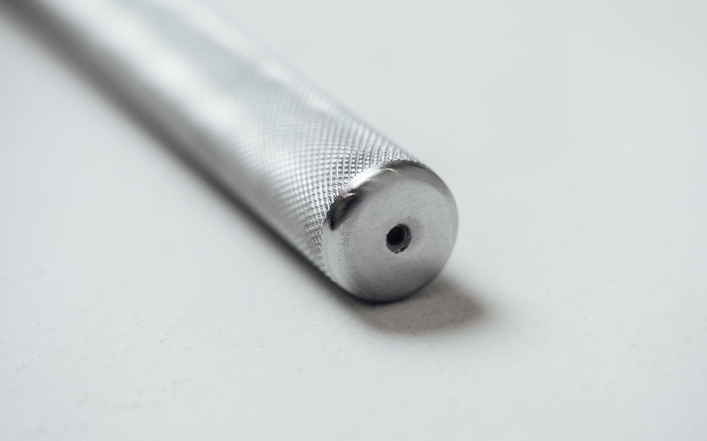 Close up of 48'' Solid Lat Bar end showing knurled grip and metal construction from Rep Fitness UK | Shop Best Premium Gym Equipment for Home & Commercial Use Online